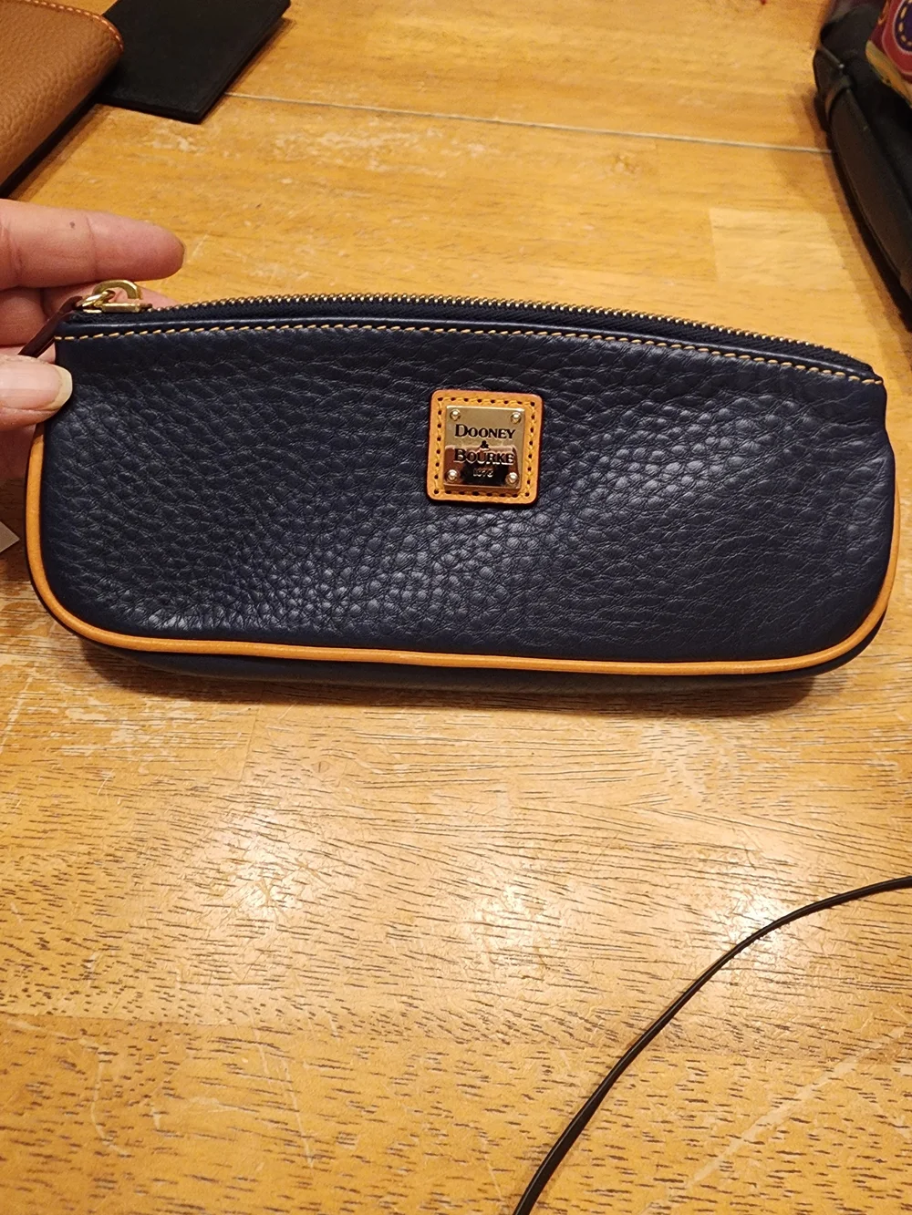 Dooney & Bourke Pebble Grain Slim Cosmetic slim pouch in navy blue Leather